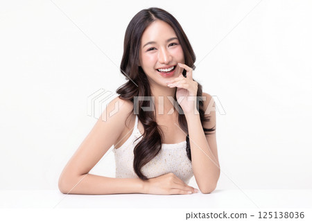Beauty portrait of happy Asian female face with natural skin make up isolated on white background. 125138036