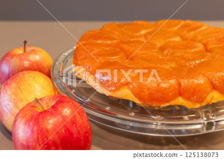Detailed view of apple Tarte Tatin (Caramelized apple tart) with shiny fruit texture Detailed view of apple Tarte Tatin (Caramelized apple tart) with shiny fruit texture 125138073
