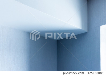 Bright and minimalist corner of an interior in blue tones Bright and minimalist corner of an interior in blue tones 125138085