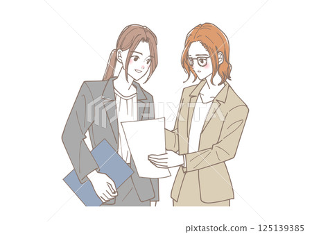 一群年輕女性正在查看文件並討論 125139385