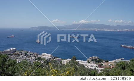 Cargo Ships Sailing on the Strait of Gibraltar near the City of Algeciras, Spain Cargo Ships Sailing on the Strait of Gibraltar near the City of Algeciras, Spain 125139569