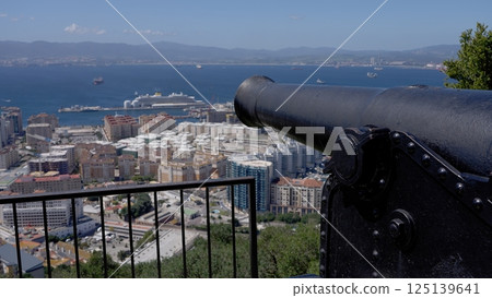 Old cannon overlooking Gibraltar harbor and city 125139641