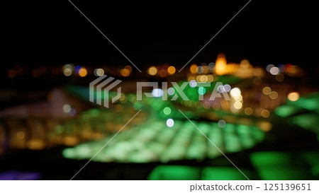 Defocused lights creating bokeh effect at night Defocused lights creating bokeh effect at night 125139651