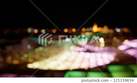 Defocused lights creating bokeh effect at night 125139654