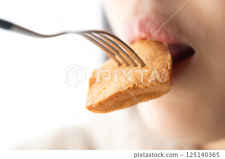 Happy moments munching on financiers Happy moments munching on financiers 125140365