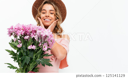 A woman wearing a pink dress 125141129