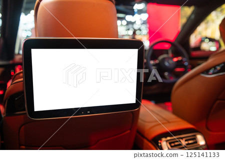 Luxury car interior with white screen for rear passenger seats 125141133