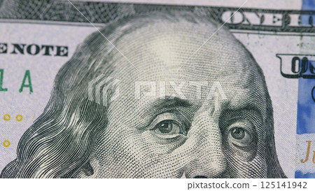 A Highly Detailed CloseUp of a One Hundred Dollar Bill, Showcasing its Intricate Features A Highly Detailed CloseUp of a One Hundred Dollar Bill, Showcasing its Intricate Features 125141942