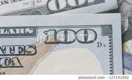 CloseUp of U.S. Hundred Dollar Bills Featuring Detailed Design and Value Indicators CloseUp of U.S. Hundred Dollar Bills Featuring Detailed Design and Value Indicators 125142092