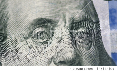 Closeup of Benjamin Franklin on the US Hundred Dollar Bill, highlighting its unique design 125142105