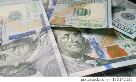 A Collection of U.S. Dollar Bills Laid Out on a Table for Detailed Analysis and Review 125142125