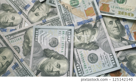 Stacks of Money Currency Notes Piled Together Neatly in Organized and Orderly Manner Stacks of Money Currency Notes Piled Together Neatly in Organized and Orderly Manner 125142140