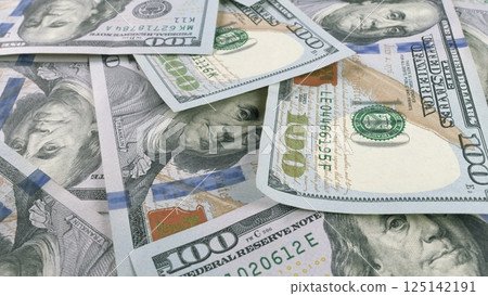 A Detailed CloseUp View of Various U.S. Dollar Bills Spread Out on a Flat Surface Area 125142191