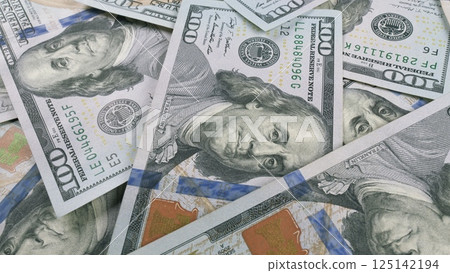 Stacks of 100 Dollar Bills Beautifully Spread Out Across the Entire Surface Area Available 125142194