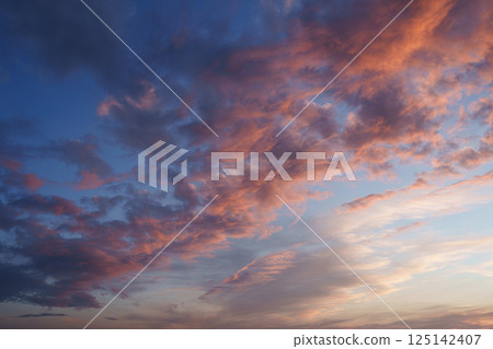 Blue pink clouds in the sky. Fantasy. The magic of sunset. Romance. Universal photo. Blue pink clouds in the sky. Fantasy. The magic of sunset. Romance. Universal photo. 125142407