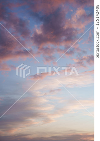 Blue pink clouds in the sky. Fantasy. The magic of sunset. Romance. Universal photo. Blue pink clouds in the sky. Fantasy. The magic of sunset. Romance. Universal photo. 125142408
