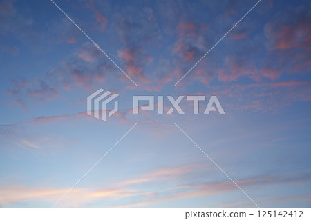 Purple clouds in the sky. Fantasy. The magic of sunset. Romance. Universal photo. Harmony. 125142412