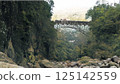 A mixed train crossing an arch bridge on the Takamori Line in the past, brought back to life in color 125142559