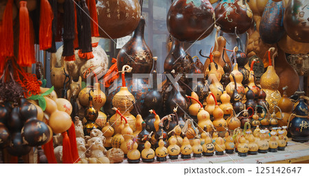 Chengdu, Sichuan, China. Souvenir Pumpkins. Souvenirs From Bottle Gourd Or Calabash. Chinese Souvenir Shop. Opo Squash, Calabash Or Hulu - Traditional Chinese Bottle Gourd Is Ancient Symbol For Health Chengdu, Sichuan, China. Souvenir Pumpkins. Souvenirs From Bottle Gourd Or Calabash. Chinese Souvenir Shop. Opo Squash, Calabash Or Hulu - Traditional Chinese Bottle Gourd Is Ancient Symbol For Health 125142647