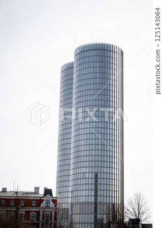 Modern Glass Skyscraper Towers with a Historic Building in the Foreground Modern Glass Skyscraper Towers with a Historic Building in the Foreground 125143064