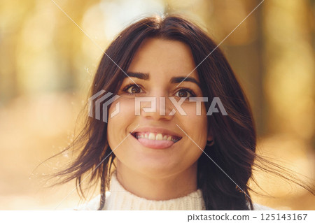 Portrait of beautiful happy woman that is smiling and showing tongue 125143167