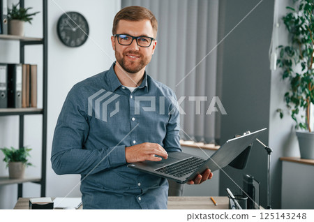 Man is working in the modern office. Conception of business and freelance Man is working in the modern office. Conception of business and freelance 125143248