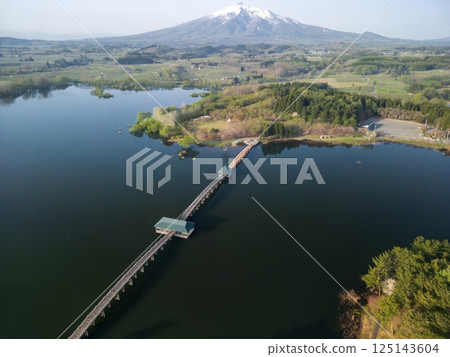 Aerial view of Tsuru no Mai Bridge and Mount Iwaki in Aomori Prefecture, Tsuruta Town 125143604