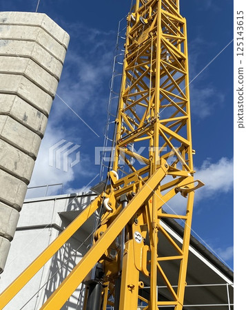 yellow crane on construction site yellow crane on construction site 125143615