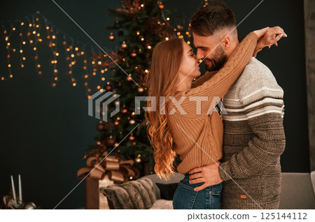 Conception of love. Young couple are celebrating New Year at home 125144112