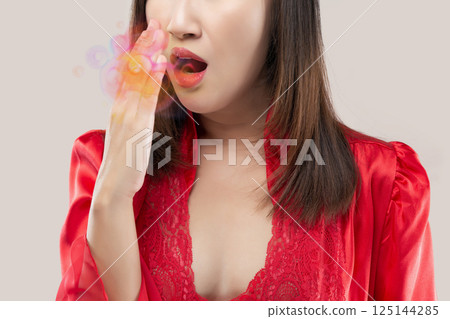 Concern rises as bad breath, known as halitosis, affects social life. 125144285