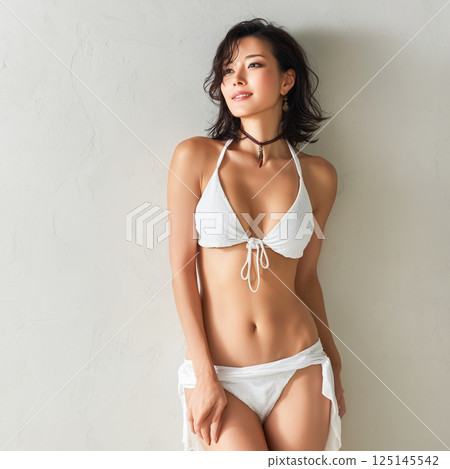 Woman in swimsuit studio shot 125145542