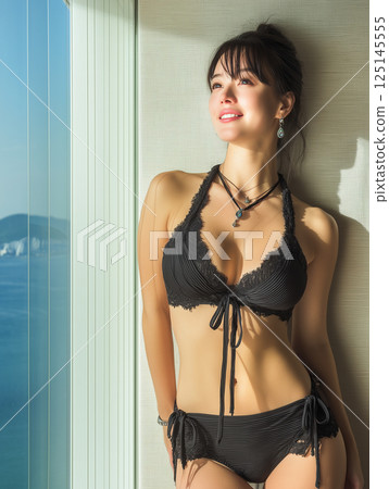 Woman in swimsuit studio shot 125145555