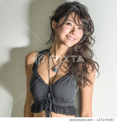 Woman in swimsuit studio shot 125145561