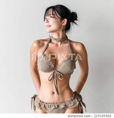 Woman in swimsuit studio shot 125145562