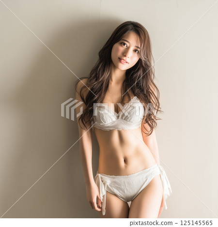Woman in swimsuit studio shot 125145565