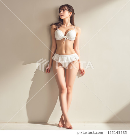 Woman in swimsuit studio shot Woman in swimsuit studio shot 125145585