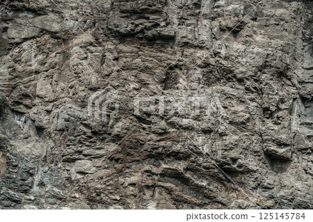 Rough stone dark texture background  125145784