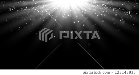 Dramatic Light Rays Illuminated by Glittering Particles Set Against a Dark Background, Creating an Enchanting Scene 125145933