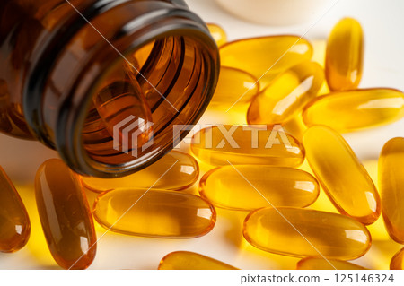 Fish oil Omega 3 capsules vitamin with EPA and DHA isolated on white background. Fish oil Omega 3 capsules vitamin with EPA and DHA isolated on white background. 125146324