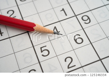 Sudoku puzzle game playing to challenge brain. 125146334