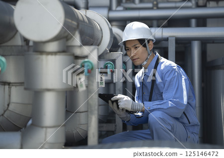 Workers inspecting building facilities 125146472