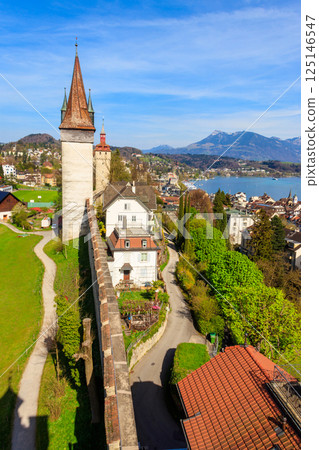 Top view on Lake Lucerne and old town with Musegg wall and towers in Lucerne city, Switzerland Top view on Lake Lucerne and old town with Musegg wall and towers in Lucerne city, Switzerland 125146547
