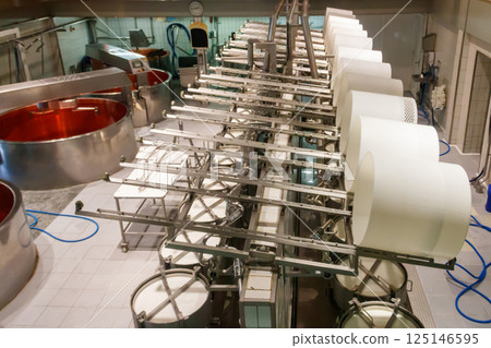 Interior of the cheese dairy factory. Equipment at cheese dairy plant Interior of the cheese dairy factory. Equipment at cheese dairy plant 125146595