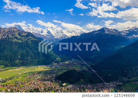 Breathtaking aerial view of Interlaken and Swiss Alps from Harder Kulm viewpoint, Switzerland Breathtaking aerial view of Interlaken and Swiss Alps from Harder Kulm viewpoint, Switzerland 125146609