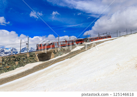 Beautiful view of the Swiss Alps with cogwheel train of Gornergrat railway close to Zermatt, Switzerland Beautiful view of the Swiss Alps with cogwheel train of Gornergrat railway close to Zermatt, Switzerland 125146618