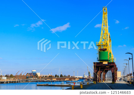 Old cranes on city boulevard in Szczecin, Poland Old cranes on city boulevard in Szczecin, Poland 125146683