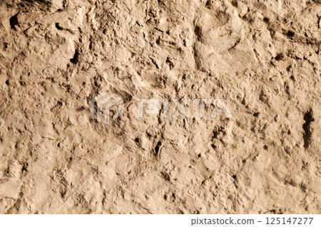 Rough yellow sandstone wall background Rough yellow sandstone wall background 125147277