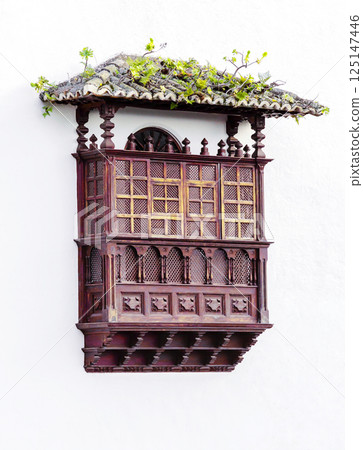 Tenerife typical wooden balcony on a wall Tenerife typical wooden balcony on a wall 125147446