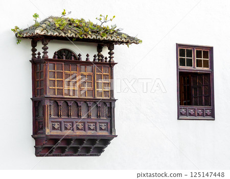 Tenerife typical wooden balcony on a wall 125147448