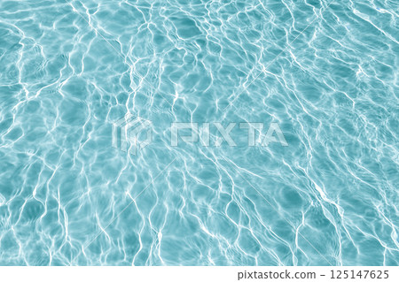 Blue transparent water with flecks of sunshine 125147625